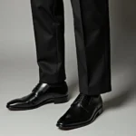 Black dress shoes paired with black pants