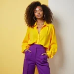 Woman in a chic yellow blouse and purple wide-leg pants