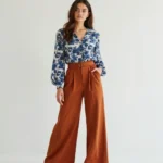 Rust Pants Paired with a Floral Print Blouse