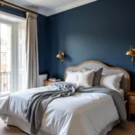 Bedroom with gold and navy blue color scheme