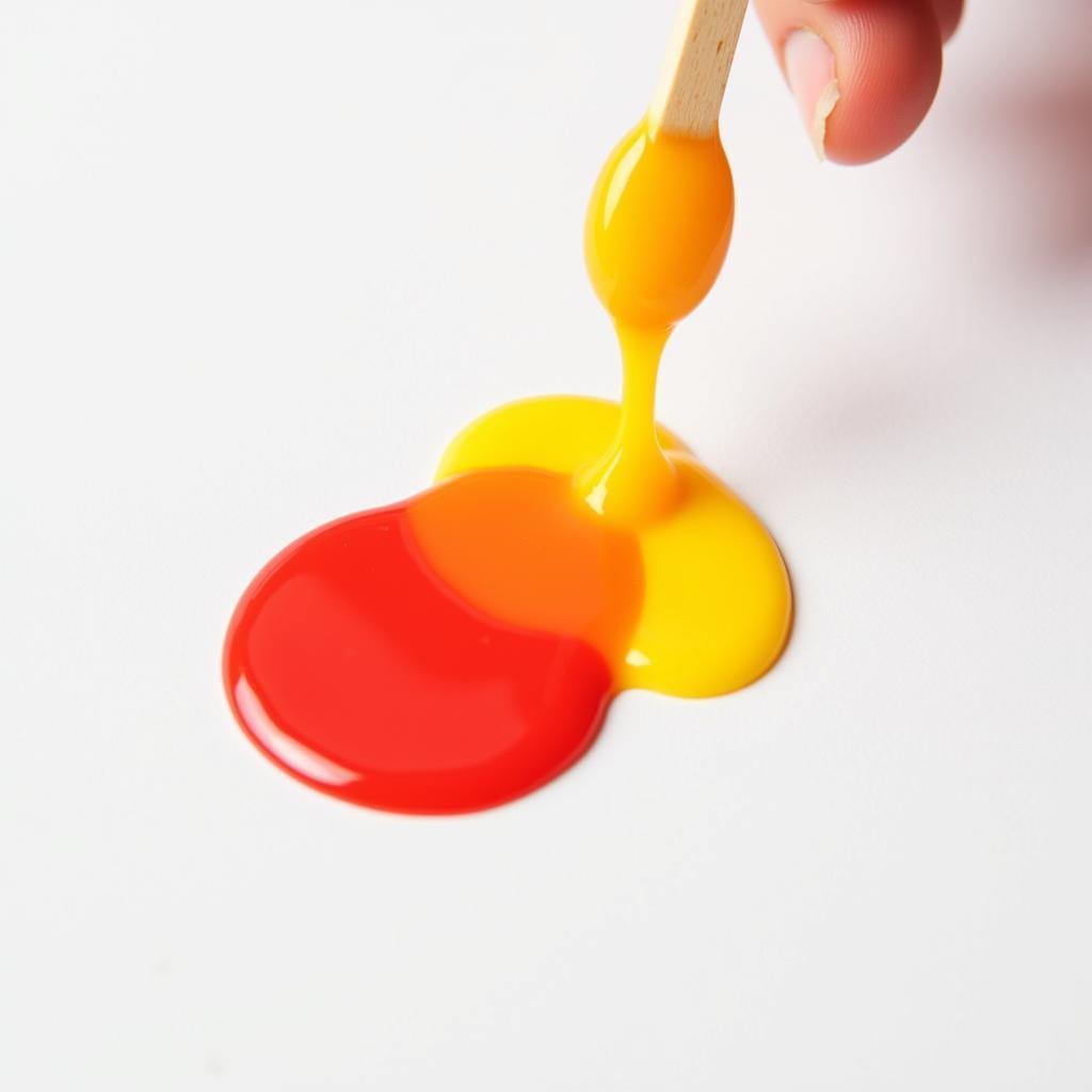 Mixing Red and Yellow Food Coloring