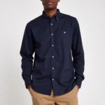 Man in a navy shirt and khaki pants