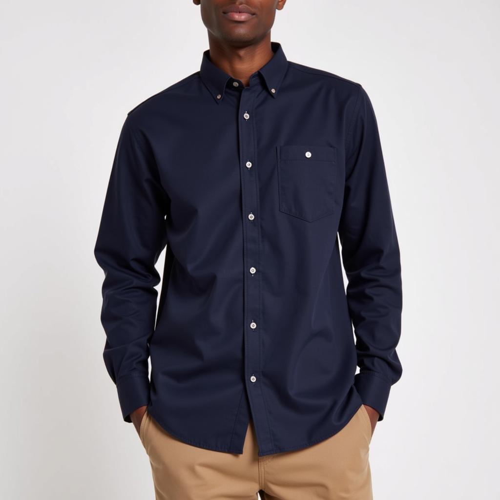 Man in a navy shirt and khaki pants