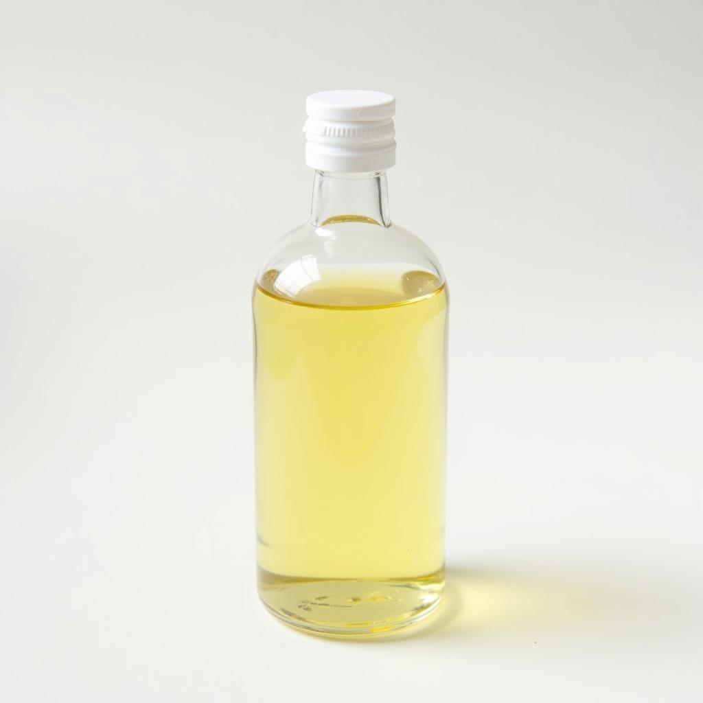 Pale Yellow Castor Oil in a Glass Bottle