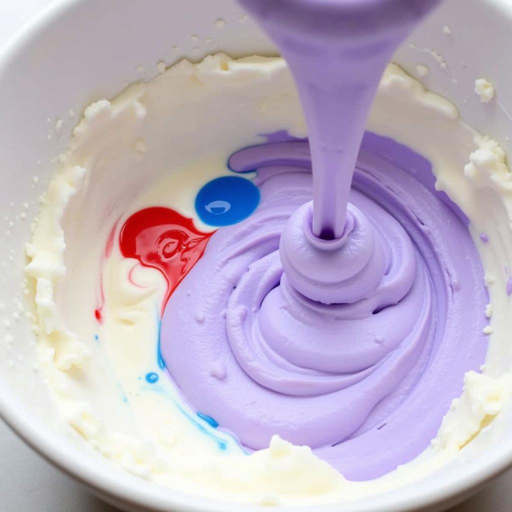 Mixing purple frosting with food coloring