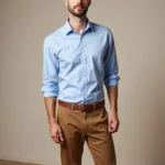 Man wearing cool brown pants and a light blue shirt