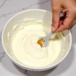 Mixing Gold Food Coloring into Icing