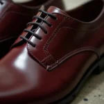 Close-up of cordovan leather shoes showing the rich burgundy color