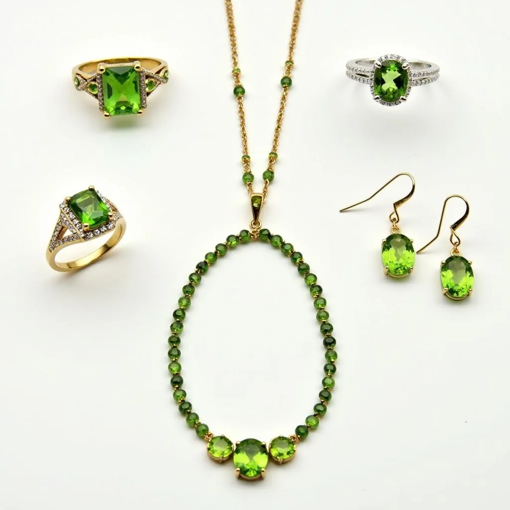 An assortment of peridot jewelry, including rings, earrings, and a necklace.