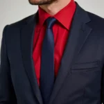 Man in a red shirt and navy blue tie