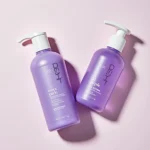 Purple toning shampoo and conditioner bottles.