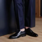 Black leather Oxfords paired with a navy suit