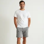 Man in Light Gray Shorts and White Shirt