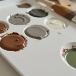 Mixing paint to create taupe