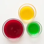 Bowls of natural food dyes made from beetroot, turmeric and spinach