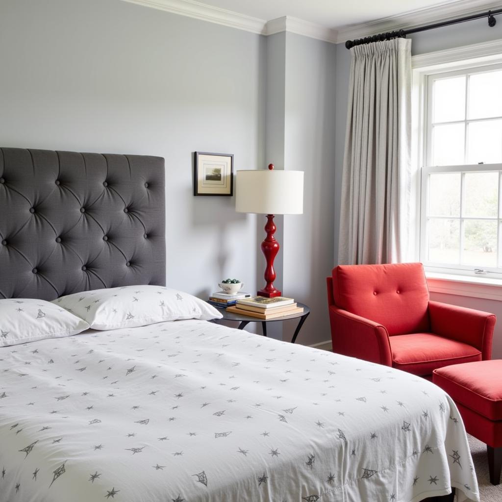 Gray Bedroom with a Red Accent Chair