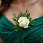 White corsage on a green dress