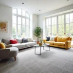 Modern living room with white walls and grey carpet