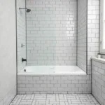 Black grout with light gray tile in a modern bathroom