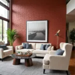 Brick red wall with cream sofa and gray accents in a living room