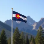 Colorado Flag at Half-Mast with Mountain Backdrop