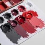 Dark Grey and Red Paint Mixture on a Palette