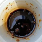 Dark Hydraulic Fluid Indicating Contamination