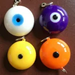 Evil eye colors white, purple, yellow, and orange