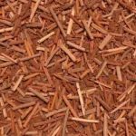 Fresh cedar mulch displaying a rich reddish-brown color