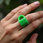 Green Mood Ring on a Finger