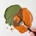 Mixing Green and Orange Paint Creates Brown