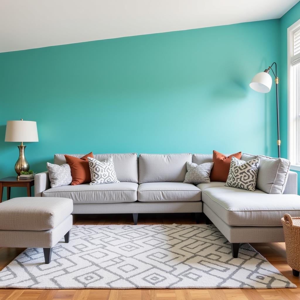 Living room with grey furniture and a colorful accent wall