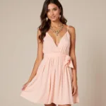 Light pink dress with gold accessories