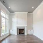 Living Room with Contrasting Ceiling, Walls, and Crown Molding