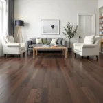 Dark wood floors in a living room with contrasting light-colored furniture.